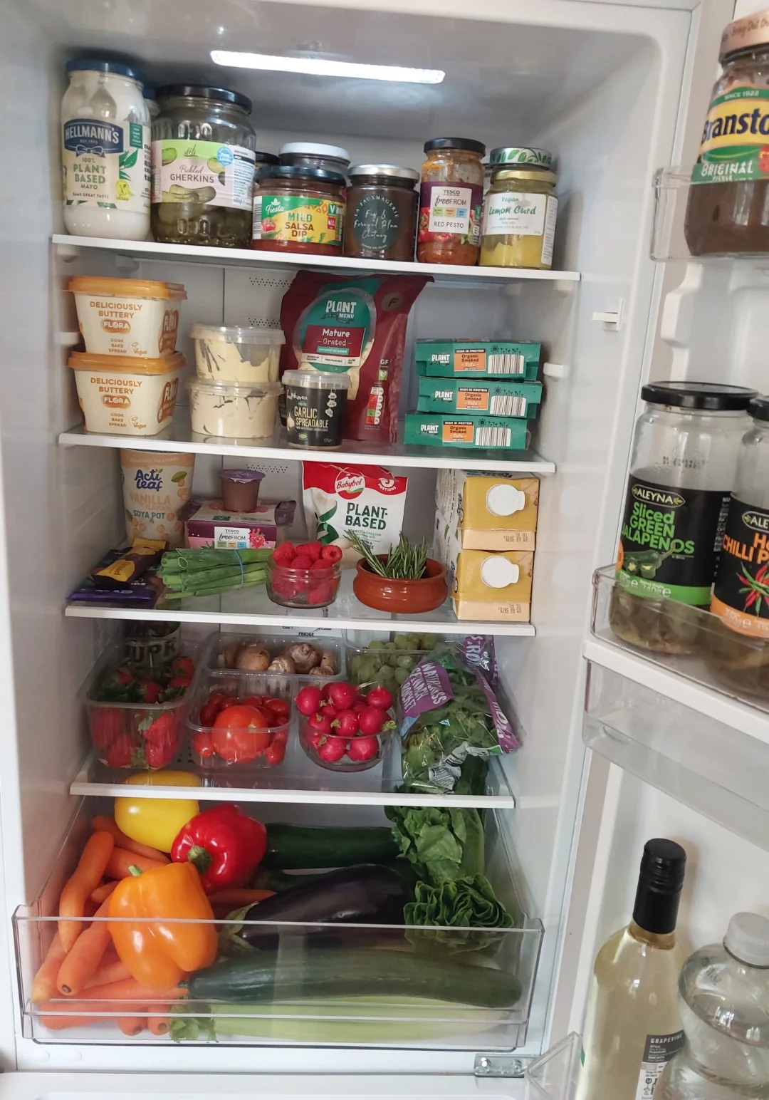 Fruit and vegetables within a fridge.